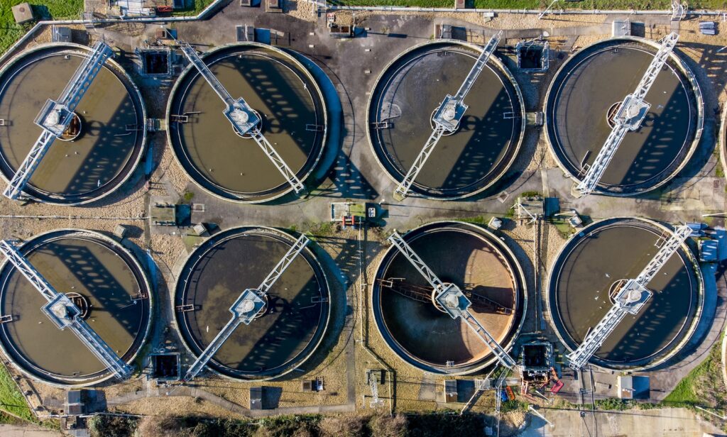 a large group of water tanks sitting next to each other